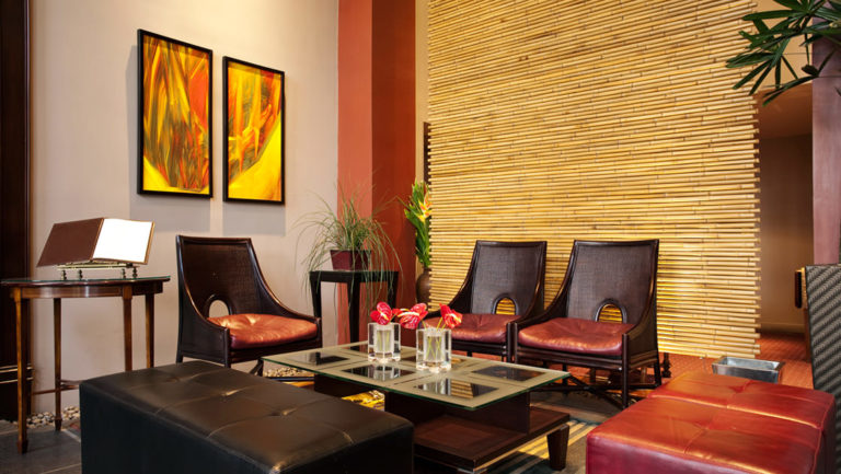 Chairs are situated around a table in the lobby of the Grano de Oro, a boutique hotel in San Jose, Costa Rica
