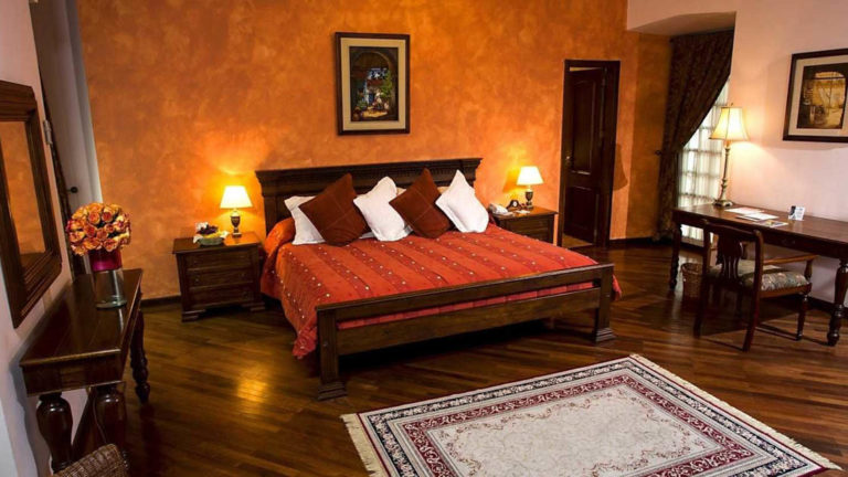 A room at the colonial-era Hotel Patio Andaluz in Quito, Ecuador, has an extra large double bed