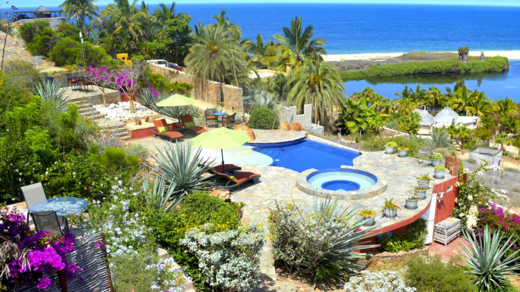 The boutique Baja hotel Los Colibris Casitas is has a deep connection to the local environment with desert vibes, pools, vegetation and views of the ocean