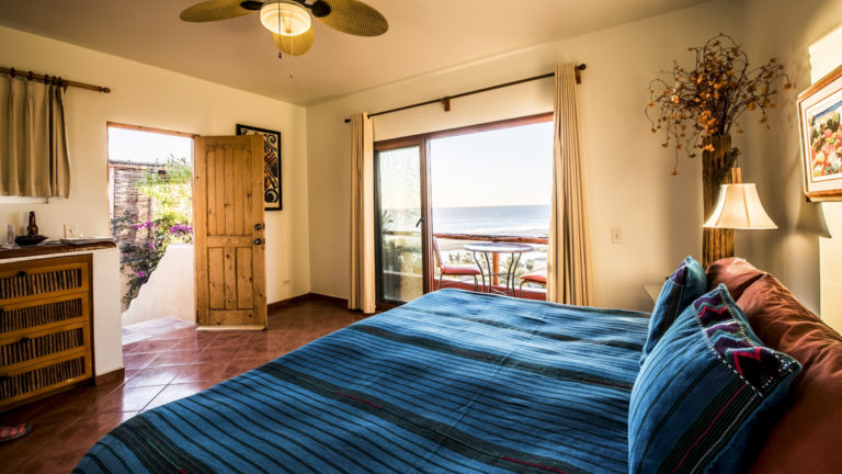 A private condo with two beautifully decorated bedrooms, a large kitchen, roof-top terrace, playroom, a wide veranda, outdoor gas grill and private parking at the boutique Baja hotel Los Colibris Casitas
