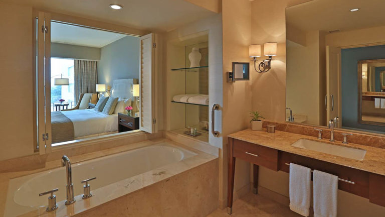 The bathroom in the Tower Executive Room with a large bathtub and modern vanity at the Bristol Panama Hotel