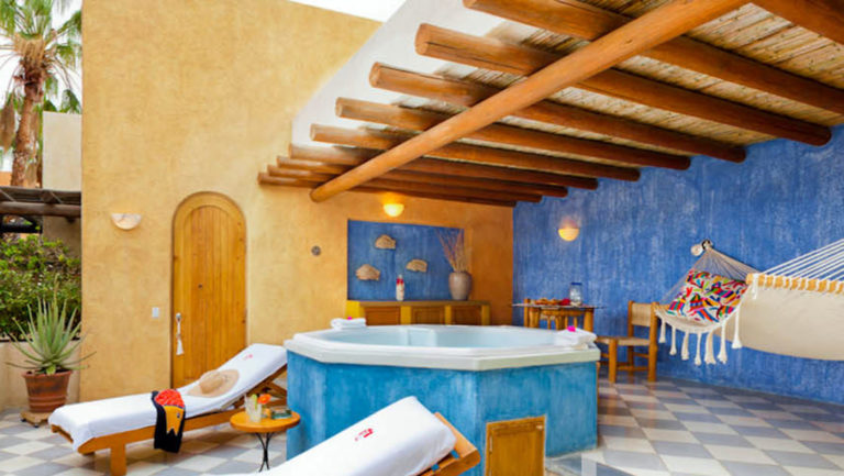 Private Jacuzzi tub with two lounge chairs, hammock and sitting area outside Spa Suite at Casa Natalia in San Jose del Cabo on the Baja Peninsula