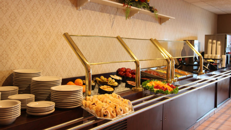 Breakfast buffet with fresh fruit and pastries at Clarion Suites in Anchorage