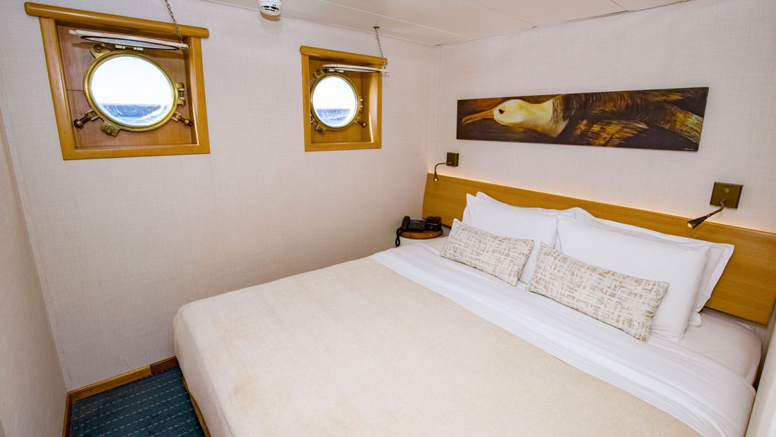 Galapagos Legend Standard Plus double bed cabin with portholes