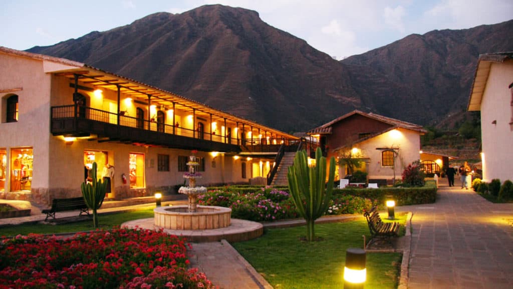 Lights illuminate the courtyard, gardens, and fountains at Sonesta Posadas Del Inca Sacred Valley Yucay, located ini Peru and only a train ride from Machu Picchu