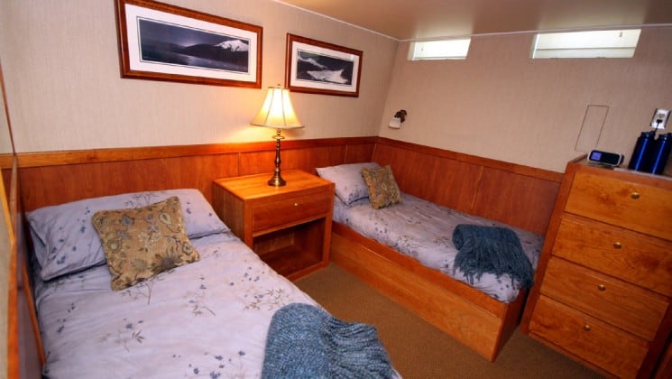 Mariner Stateroom with twin beds aboard Safari Quest. Photo by: UnCruise