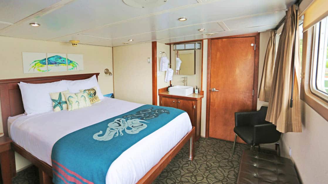 Owner's Suite with large bed aboard Admiralty Dream