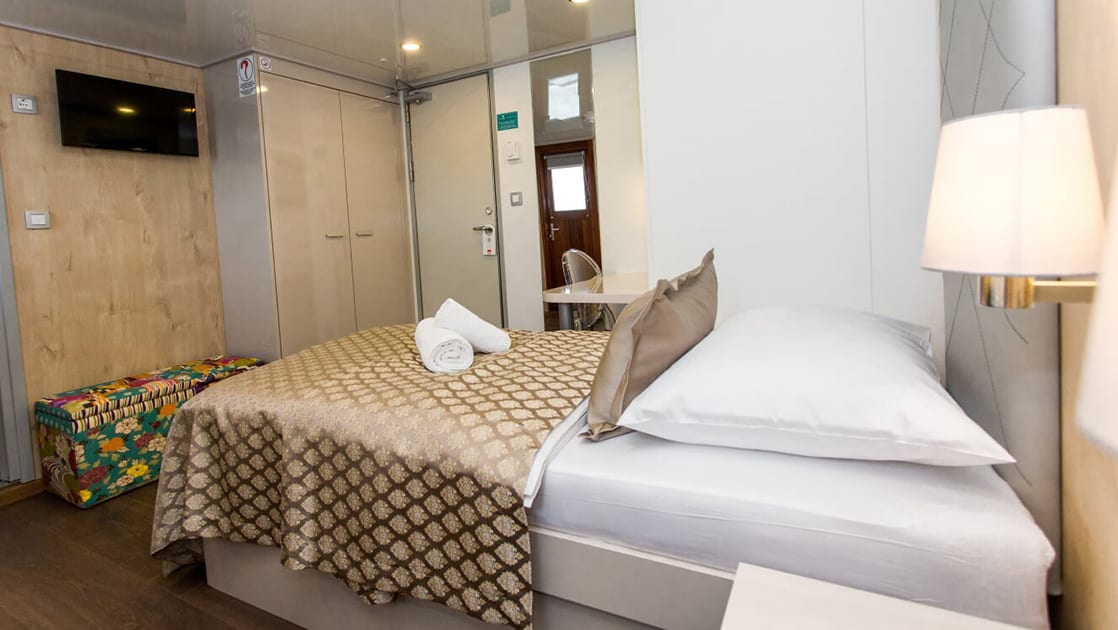 Mediterranean small ship Adriatic Sun's only Main Deck cabin with one double bed and a window.