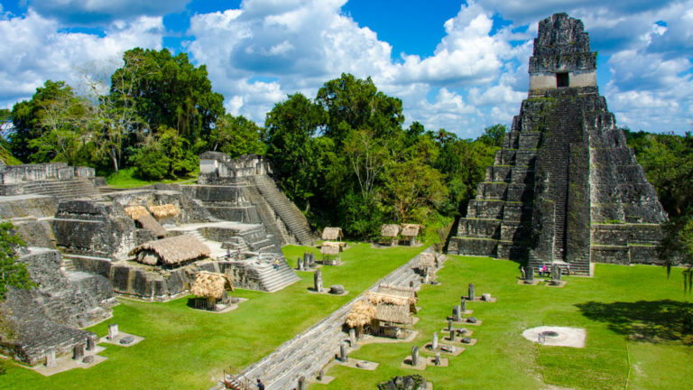 View from one of the temples looking down at a plaza in Tikal Guatemala