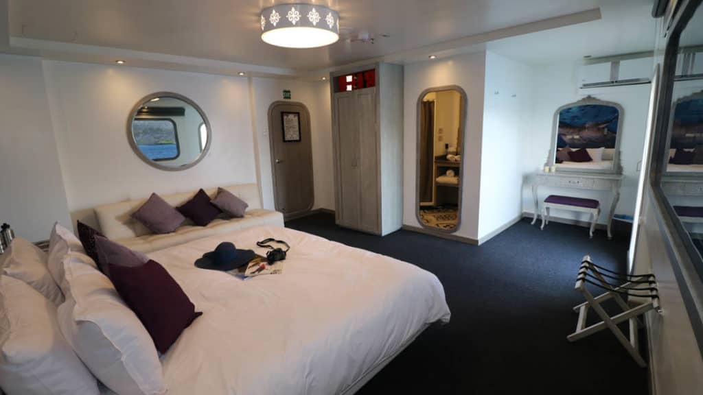 Stateroom with matrimonial bed and couch for optional triple accommodation aboard Camila