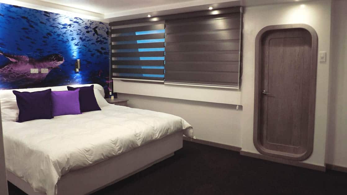 Stateroom with matrimonial bed and window aboard Camila