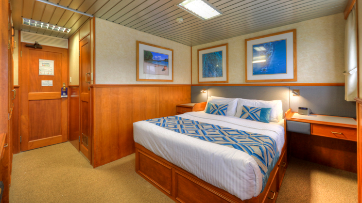 Stateroom with double bed aboard Coral Expeditions II 