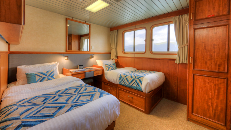 Stateroom with twin beds aboard Coral Expeditions II 