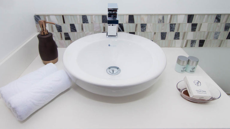 Up close of the sink and bathroom toiletries provided in a cabin aboard Alya.