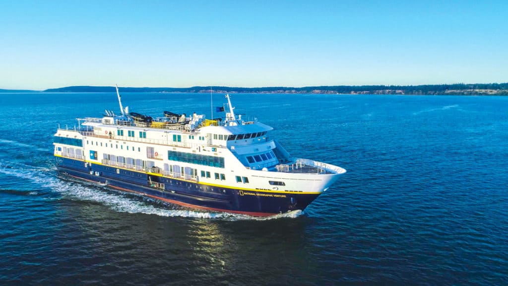 Exterior shot of National Geographic Venture ship in the open sea.