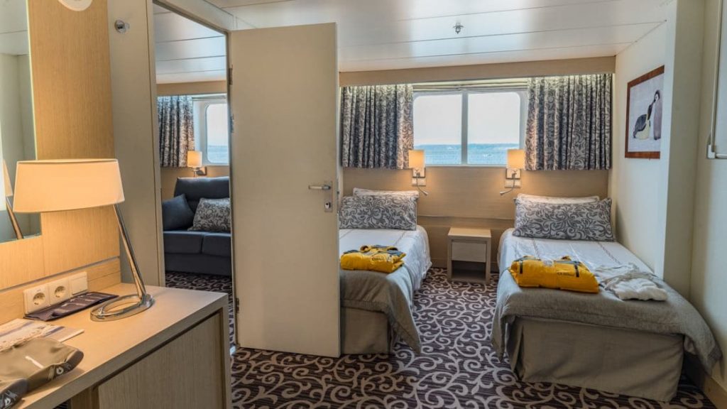 Suite with twin beds aboard Ocean Diamond