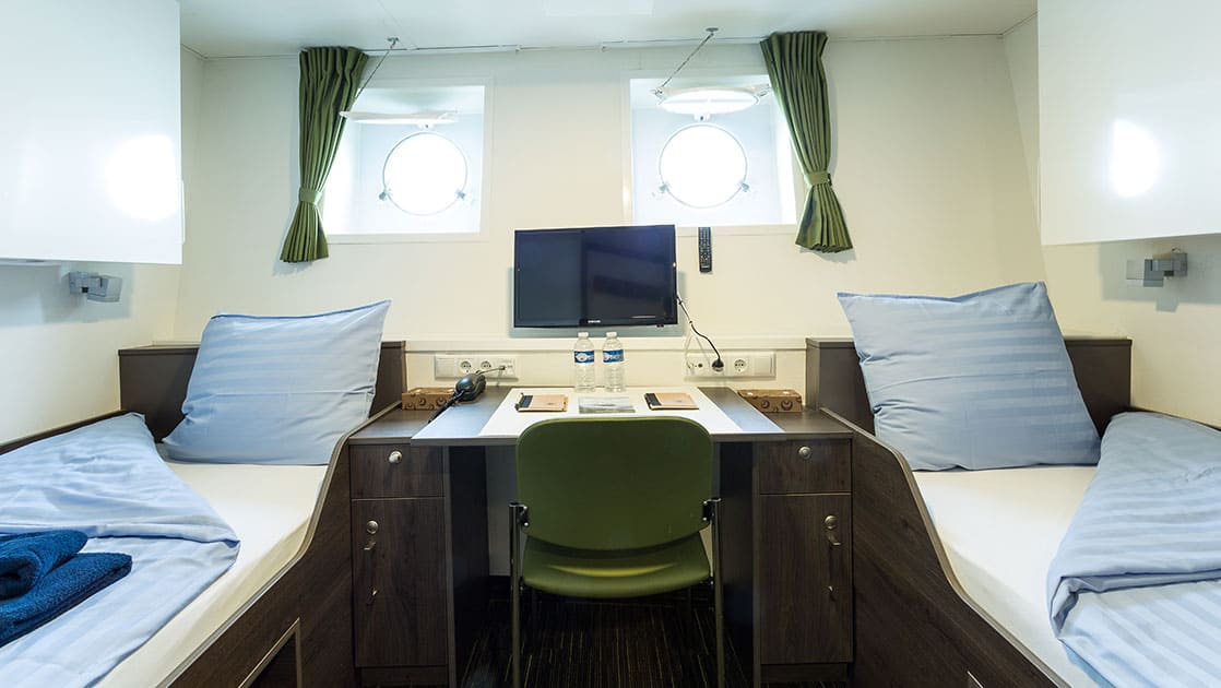 twin porthole cabin aboard Ortelius small ship in Antarctica