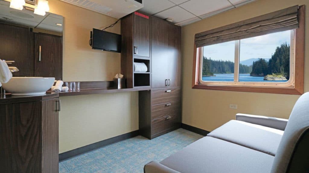 Trailblazer cabin 106 with wallbed in sofa configuration aboard Wilderness Explorer