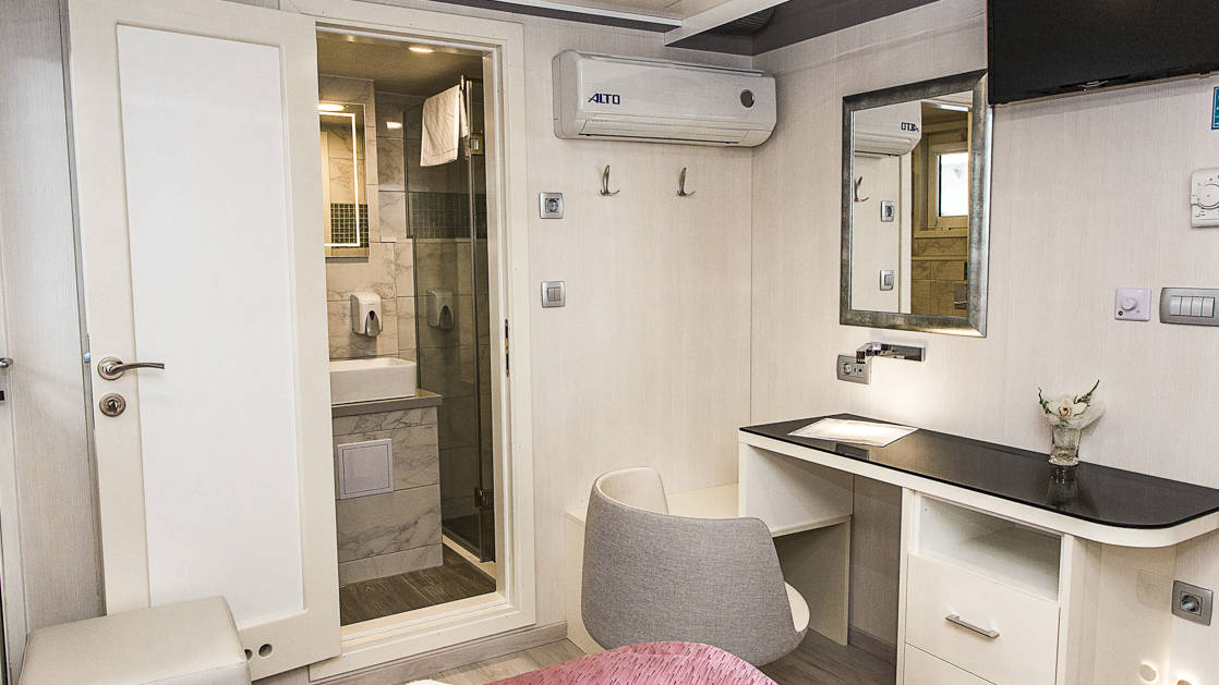 Lower Deck cabin with desk and bathroom aboard Ave Maria