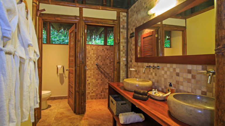 The bathroom in a superior suite features hot showers and L'Occitane products at La Selva Amazon EcoLodge, a sustainable, luxury accommodation in Ecuador