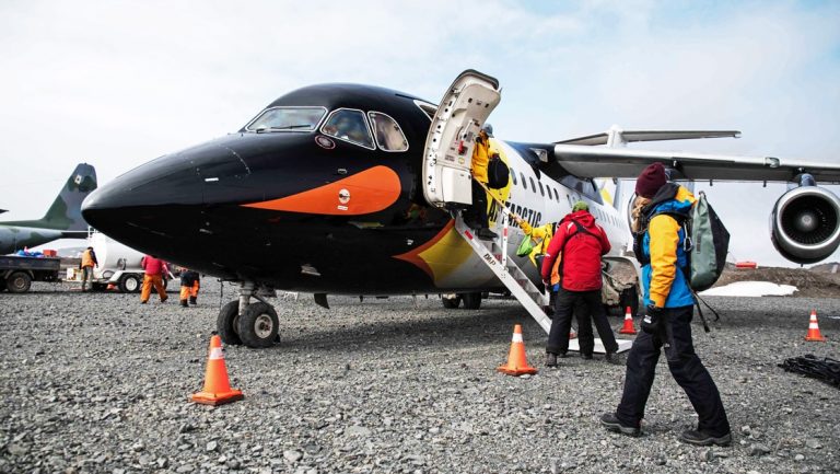 Antarctic Express Fly the Drake Cruise plane with passengers boarding the plane to Antarctica.