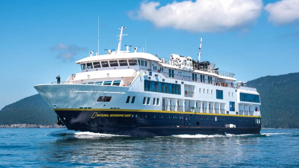Full exterior of port side and bow of National Geographic Quest luxury expedition ship