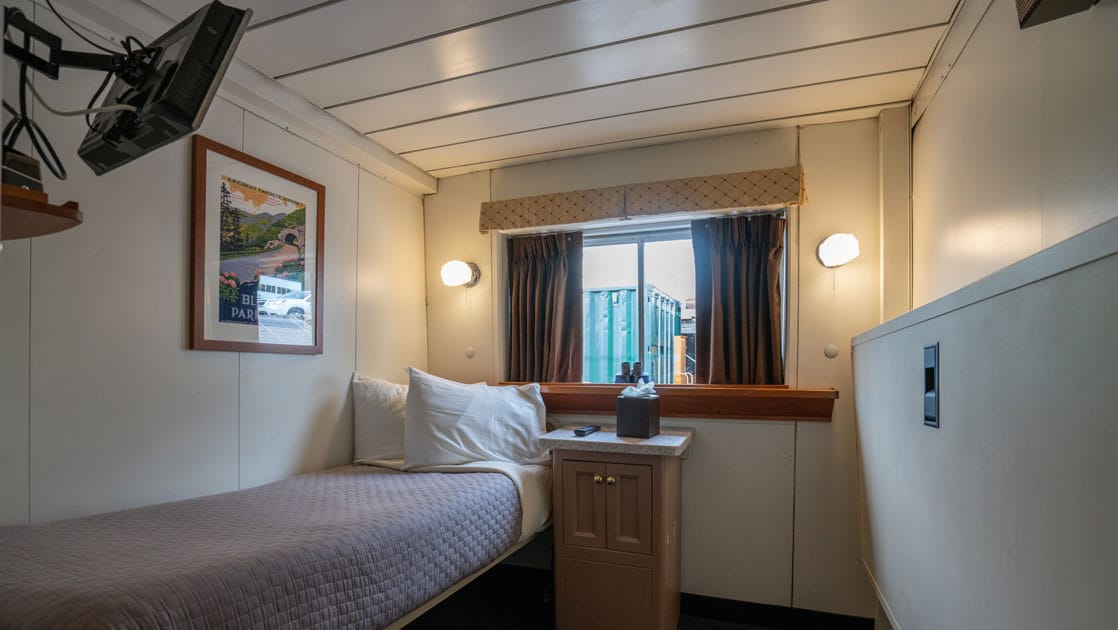 Single cabin with twin bed and pullman berth aboard Wilderness Adventurer.