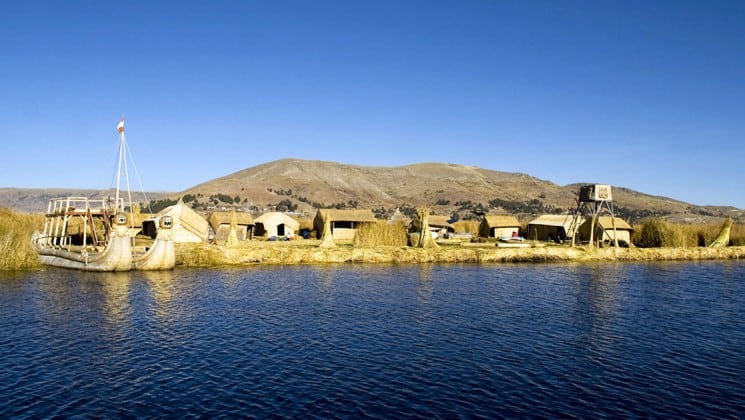 village on coast of lake titicaca on peru land tour