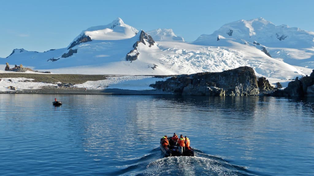 Polar travelers head to shore in a Zodiac on the Antarctic Southern Latitudes voyage.