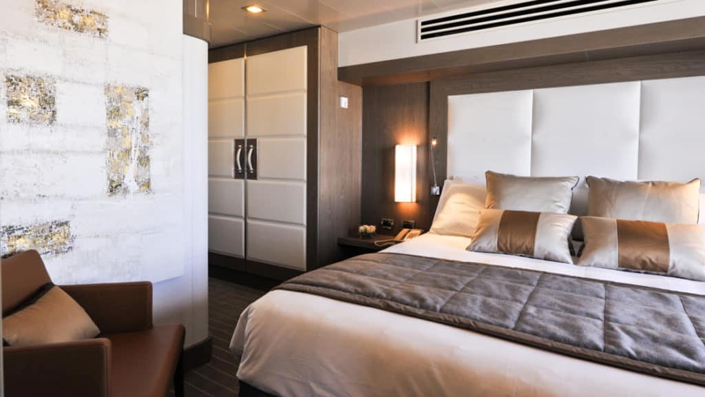 Owner's Suite with king bed aboard Le Boreal. Photo by: Francois Lefebvre/Ponant