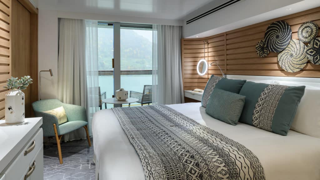 Prestige Suite - Decks 5 & 6 with king bed aboard Le Champlain. Photo by: Francois Lefebvre/Ponant