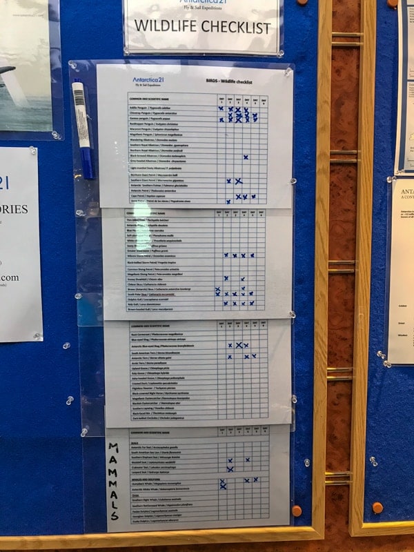 A antarctic wildlife checklist posted on the guest board of the hebridean sky polar expedition ship , shows which animals have been seen while on the cruise