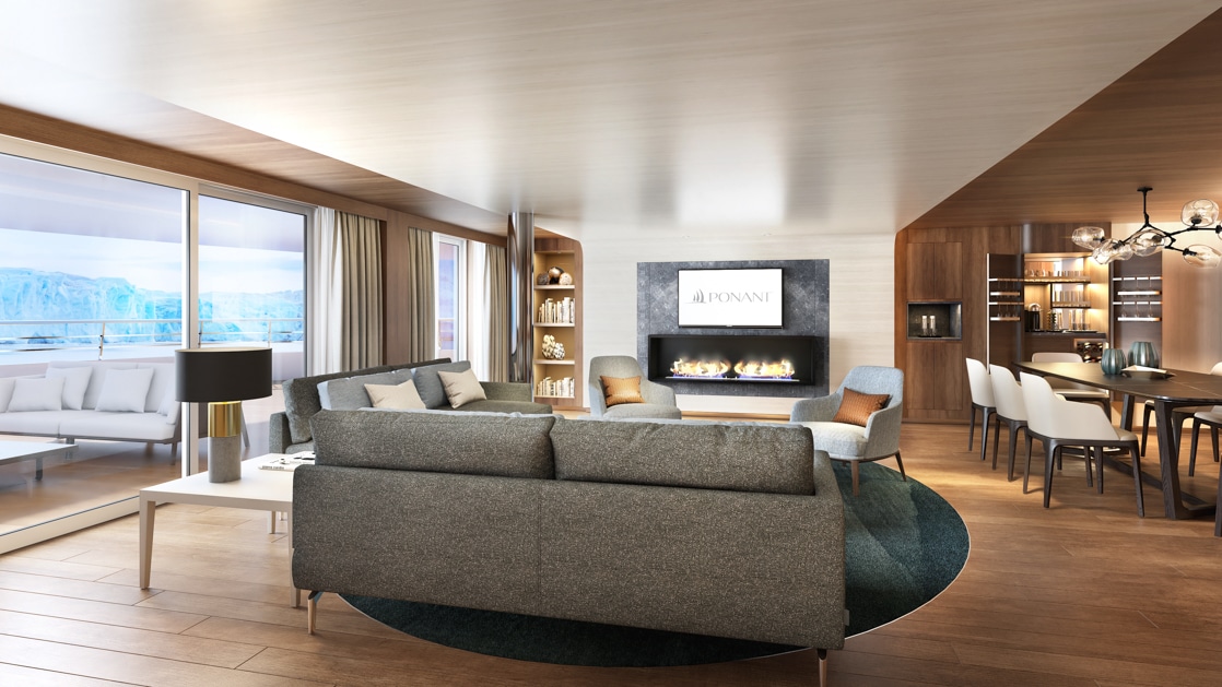 Rendering of couch, dining room table, modern light fixtures, wooden interior & wide windows looking out onto snow & ice aboard Le Commandant Charcot.