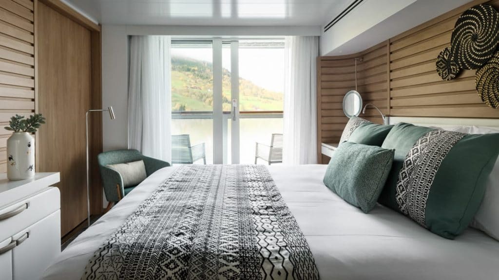 Prestige Stateroom - Decks 4, 5 & 6 with king bed aboard Le Bellot. Photo by: Francois Lefebvre/Ponant